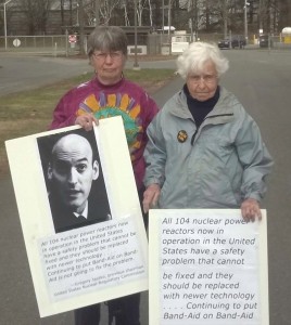 Ellen Graves is holding picture of Jaczko and Frances Crowe is holding the word-only poster. Photo by Hattie Nestle.