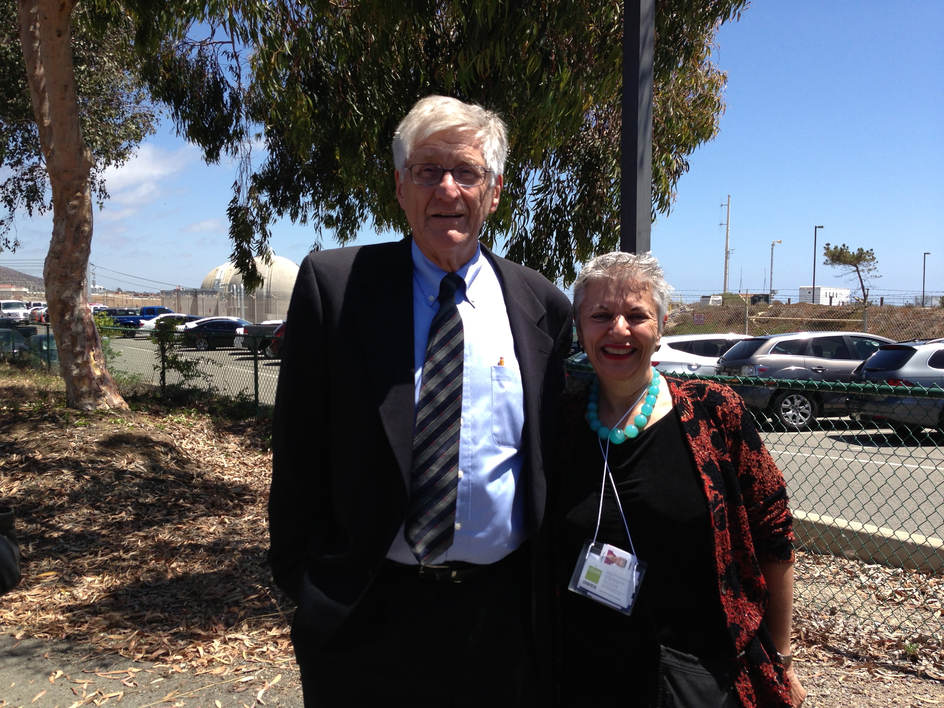 Arnie Gundersen and Libbe HaLevy in front of San Onofre Nuclear Reactors in Southern California, 3 days before decommissioning was announced.