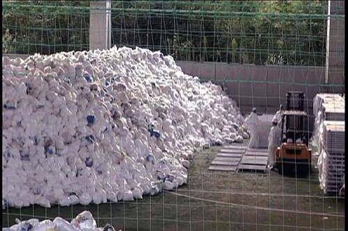 Mountain of radioactive used Tyvek protective suits at Fukushima - all dressed down and nowhere to go